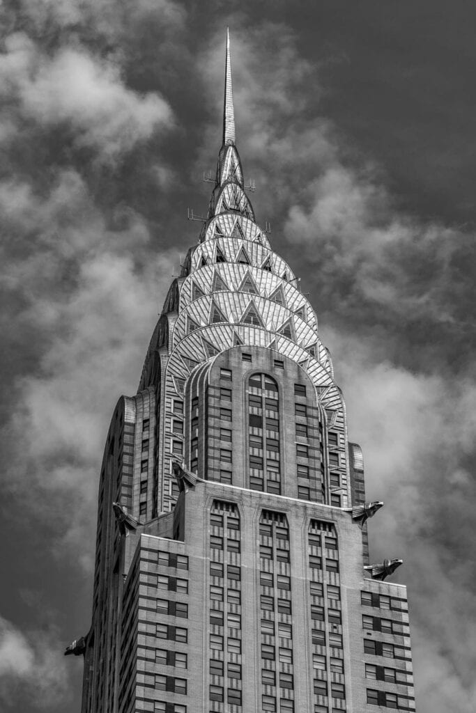 A black and white photo of the top of a building.